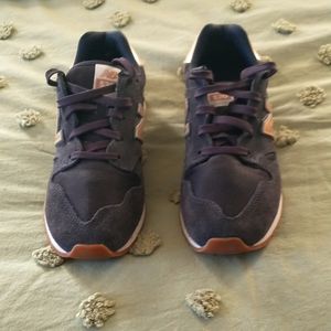 New Balance, navy sneakers with rose gold accent.  Perfect condition, no flaws